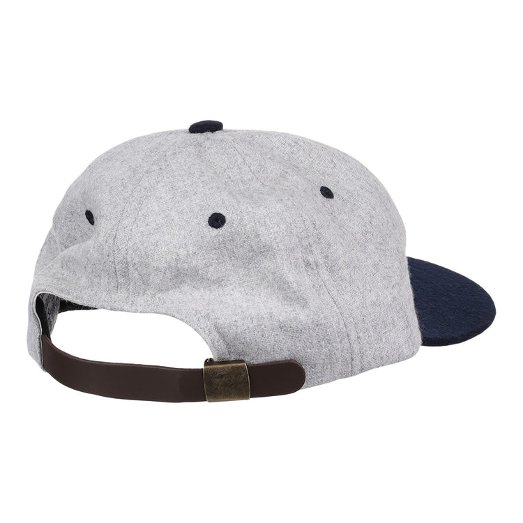 The EFF University of Nevada Wolf Pack Mascot Collegiate Wool Ballcap is shown from the back in grey and navy, featuring a brown adjustable strap with a brass-colored buckle. This is an officially licensed college vault item.