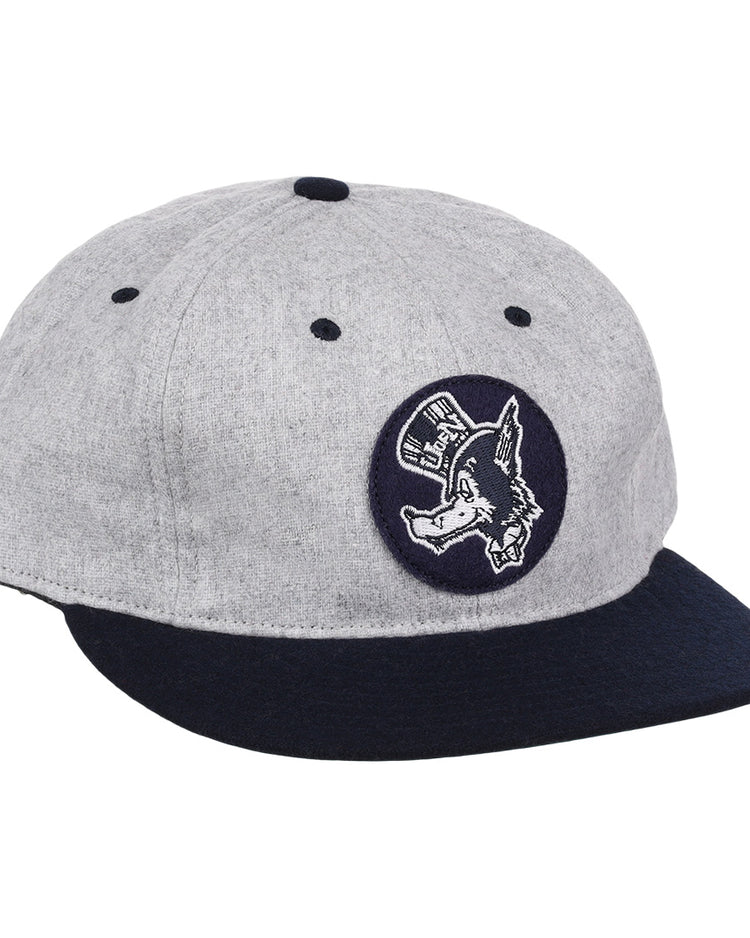The EFF University of Nevada Wolf Pack Mascot Collegiate Wool Ballcap features a vintage gray crown, dark blue brim, and a front circular patch of a donkey in a hat—an officially licensed college vault design.