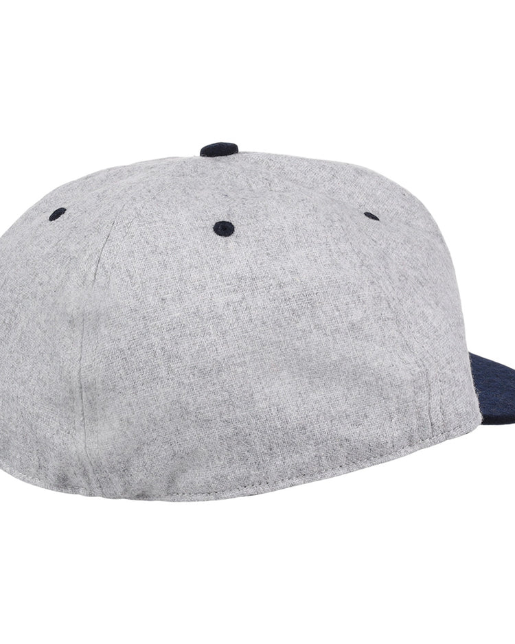 An officially licensed EFF University of Nevada Wolf Pack Mascot Collegiate Wool Ballcap with a gray crown, dark blue brim and button, back and side view, features ventilation eyelets on top—perfect for vintage fans.