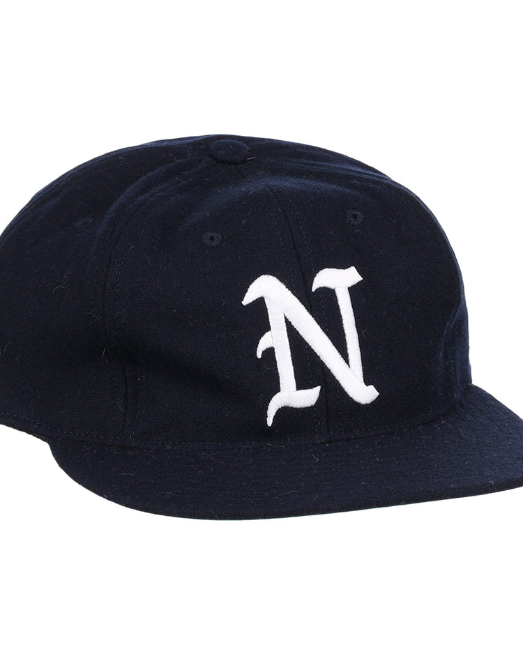 The EFF University of Nevada Wolf Pack Collegiate Wool Ballcap is a vintage navy blue hat with a curved brim and a bold white embroidered N on the front, officially licensed from the college vault.
