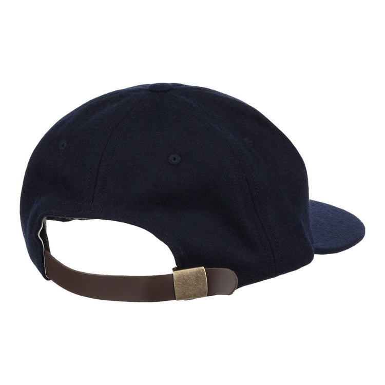 The EFF University of Nevada Wolf Pack Patch Collegiate Wool Ballcap is navy blue with a vintage look, shown from the back, featuring a rounded crown, visible stitching, and a brown adjustable leather strap with brass buckle.