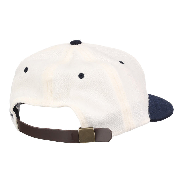 A white University of Nevada Wolf Pack Mascot Collegiate Wool Ballcap by EFF, viewed from the back, features a navy brim and a brown adjustable strap with brass buckle for a classic vintage touch.