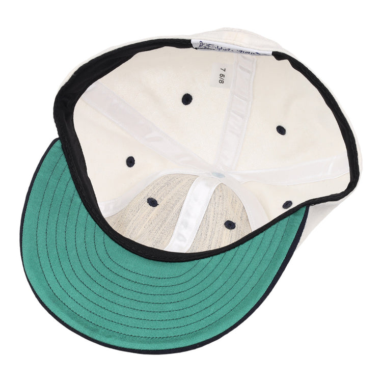 The image shows the inside of an EFF University of Nevada Wolf Pack Mascot Collegiate Wool Ballcap in white, featuring a green underbrim, black edge trim, size tag “7 5/8,” black ventilation holes, and stitched interior panels.