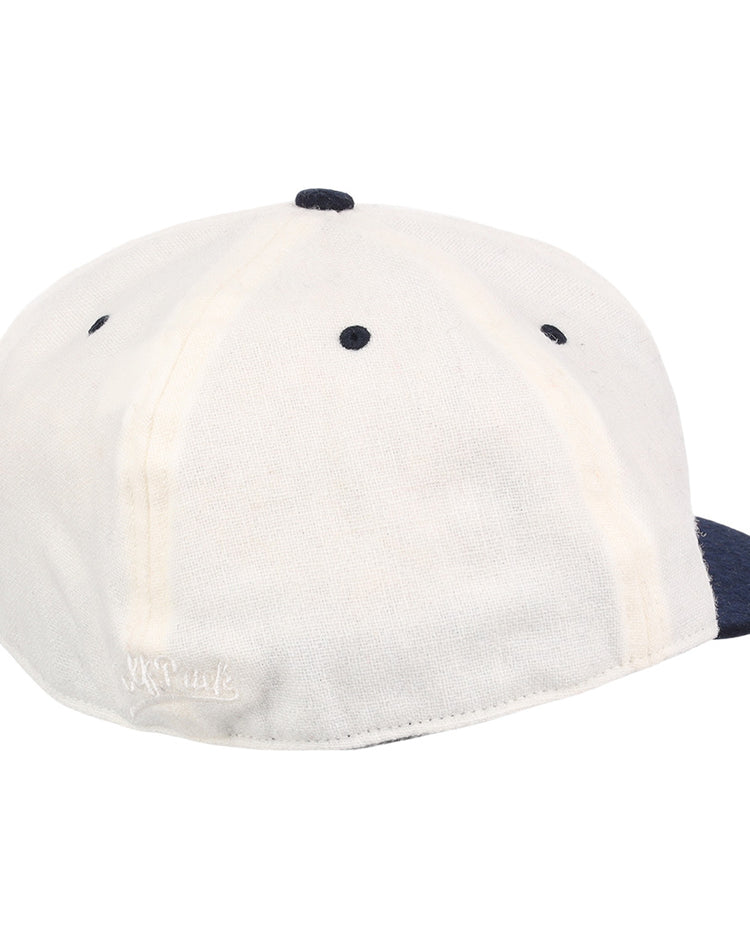 A white EFF University of Nevada Wolf Pack Mascot Collegiate Wool Ballcap with a navy blue button and brim, shown from the back on a white background. Features visible stitching and a small embroidered logo near the bottom edge.