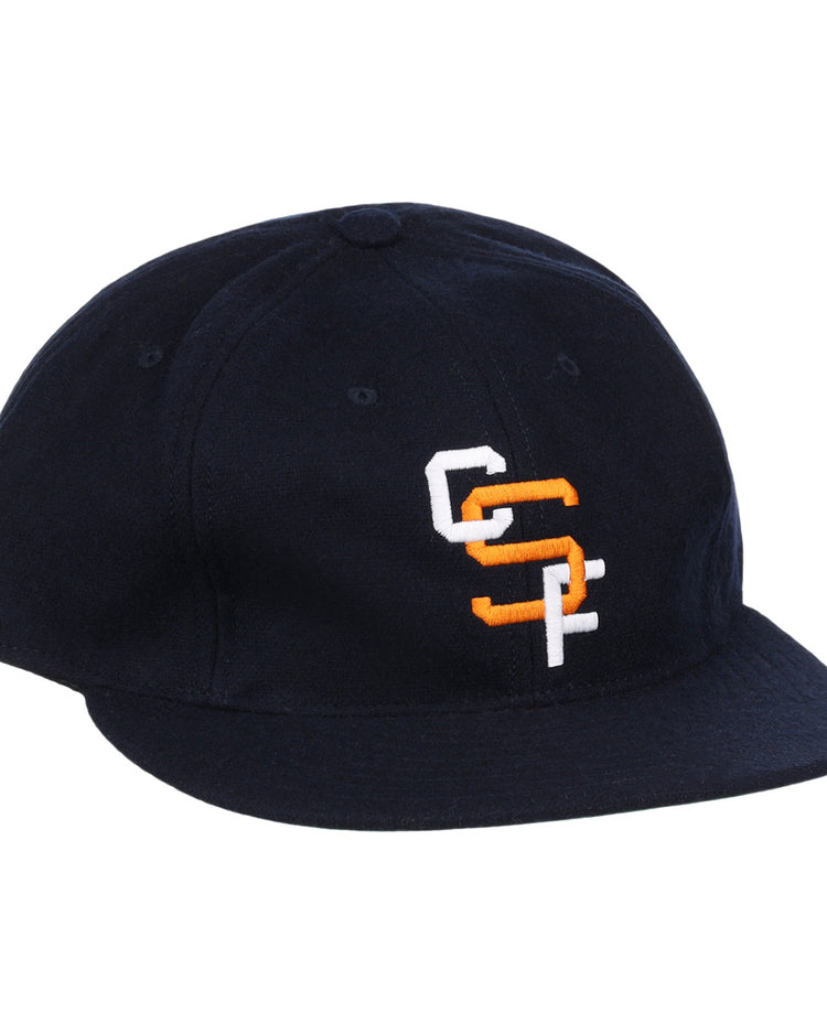 The EFF Cal State Fullerton 1965 Vintage Ballcap is a black cap with a curved brim and overlapping white and orange CC and SF embroidery on the front.