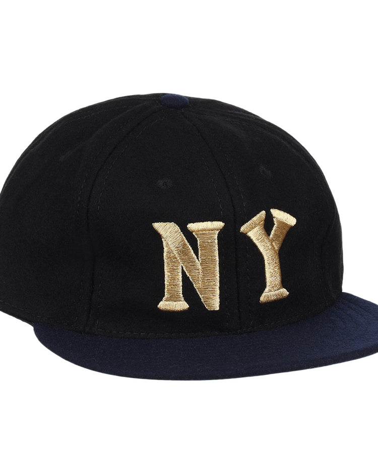 The EFF New York Black Yankees Gilded Collection Ballcap features a black crown, navy blue brim, and gold NY embroidery—an ideal tribute to the Negro National League.