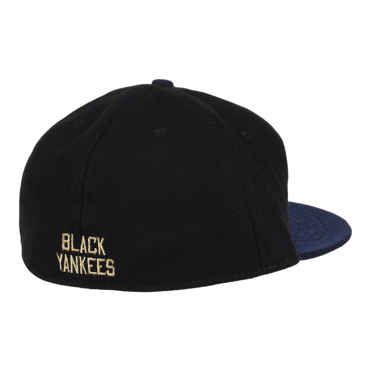 The EFF New York Black Yankees Gilded Collection Ballcap features a dark navy brim and BLACK YANKEES embroidered in yellow on the back, honoring the legendary Negro National League team.
