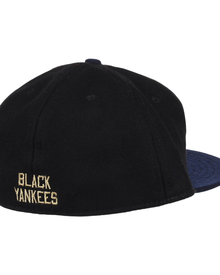 The EFF New York Black Yankees Gilded Collection Ballcap features a dark navy brim and BLACK YANKEES embroidered in yellow on the back, honoring the legendary Negro National League team.