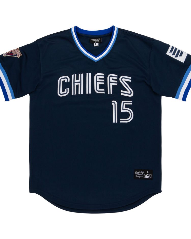 The Syracuse Chiefs EFF MiLB Vintage V-Neck Baseball Jersey by EFF is navy blue with “CHIEFS” and the number 15 in white, white and blue trim, sleeve patches, and classic International League style.