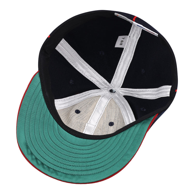 An overhead view of the Lincoln Giants 1911 Vintage Ballcap by EFF shows a green underbrim, white inner seams, a small fabric tag, and black and beige lining—details reminiscent of classic Negro League memorabilia.