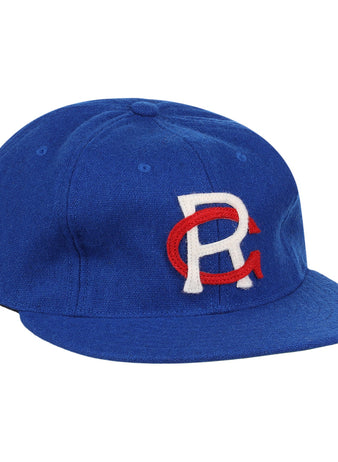 The EFF Royal Ponciana Giants 1912 Vintage Ballcap is a royal blue wool cap with a white R overlapping a red C embroidered on the front, inspired by the original 1912 team design.