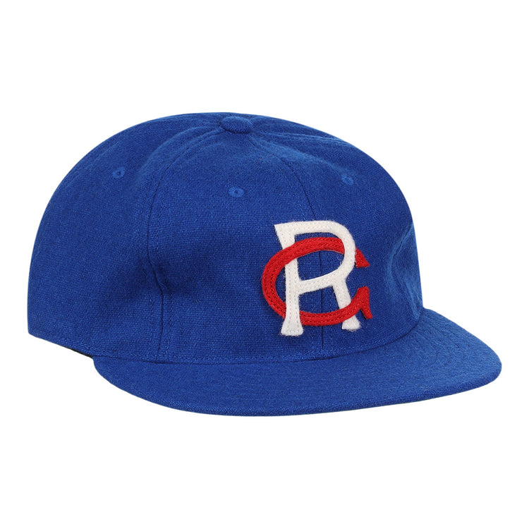 The EFF Royal Ponciana Giants 1912 Vintage Ballcap is a royal blue wool cap with a white R overlapping a red C embroidered on the front, inspired by the original 1912 team design.