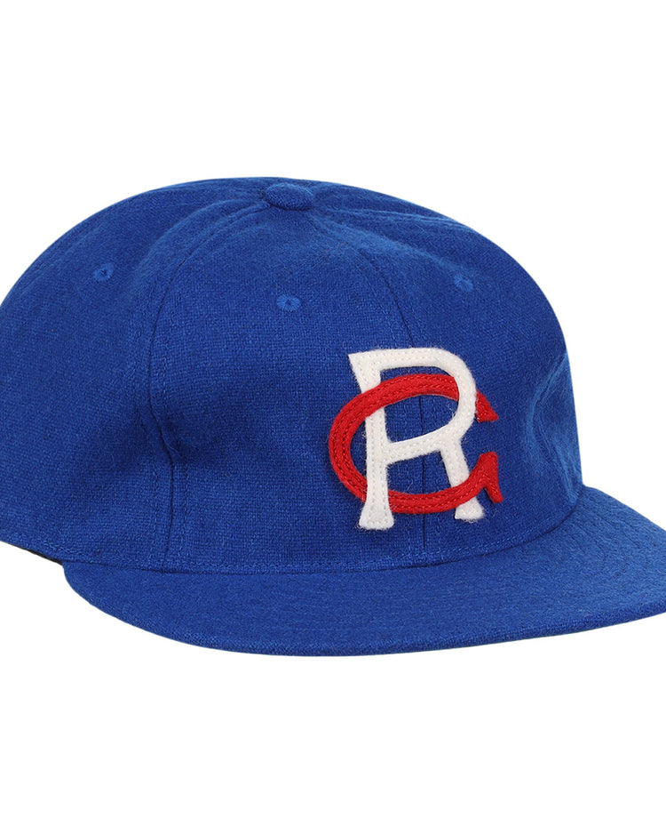 The EFF Royal Ponciana Giants 1912 Vintage Ballcap is a royal blue wool cap with a white R overlapping a red C embroidered on the front, inspired by the original 1912 team design.