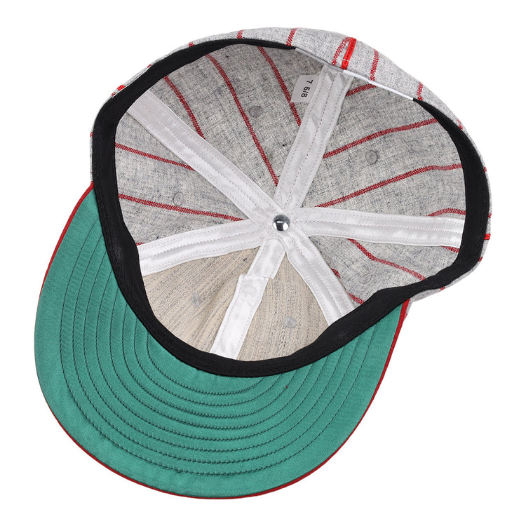 The image displays the inside of an EFF Knoxville Giants 1920 Vintage Ballcap, featuring a green brim, black lining, white bands, visible stitching, and a silver top button true to the original 1920 design.
