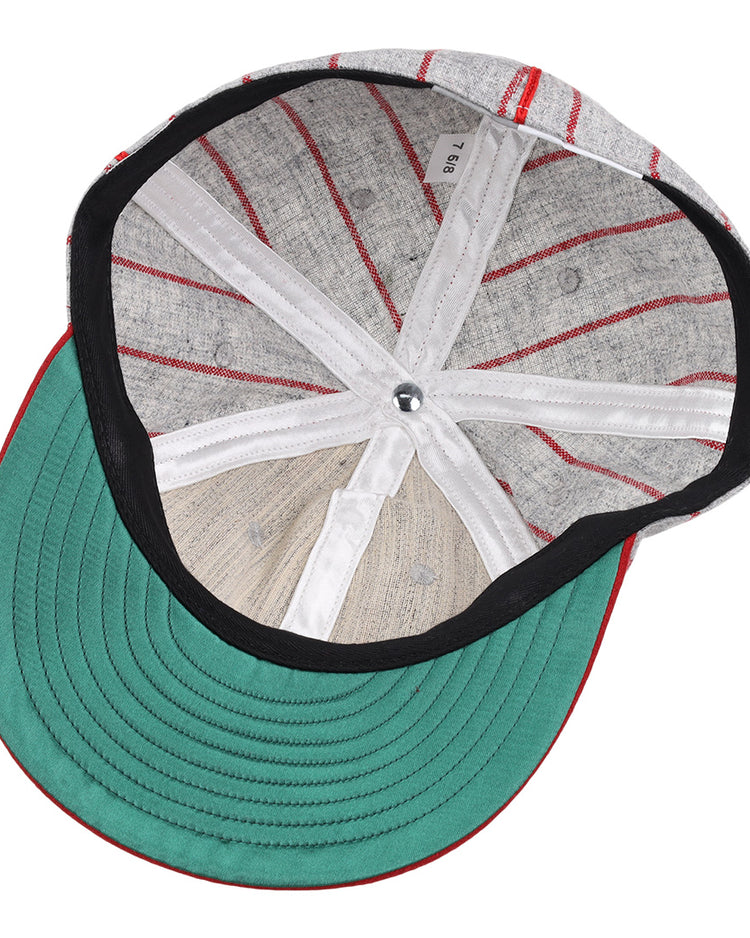 The image displays the inside of an EFF Knoxville Giants 1920 Vintage Ballcap, featuring a green brim, black lining, white bands, visible stitching, and a silver top button true to the original 1920 design.