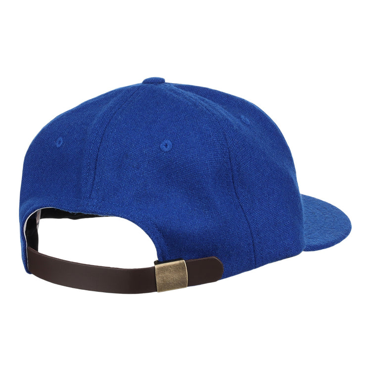 The EFF Royal Ponciana Giants 1912 Vintage Ballcap is blue, viewed from the back, and features a brown adjustable strap with a brass buckle, inspired by the classic wool caps of the 1912 ballclub.