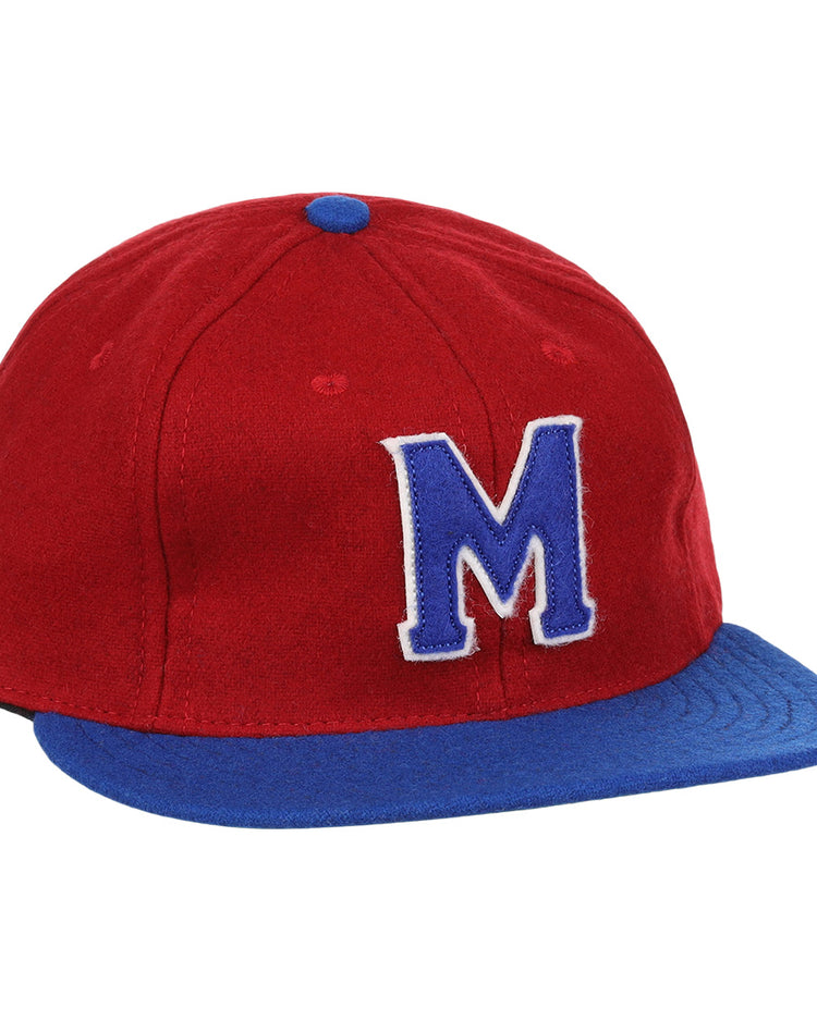 The EFF Memphis Red Sox 1946 Vintage Ballcap features a red wool crown, blue visor, bold blue M outlined in white, and a blue button on top—authentic details inspired by the classic Negro Leagues team.