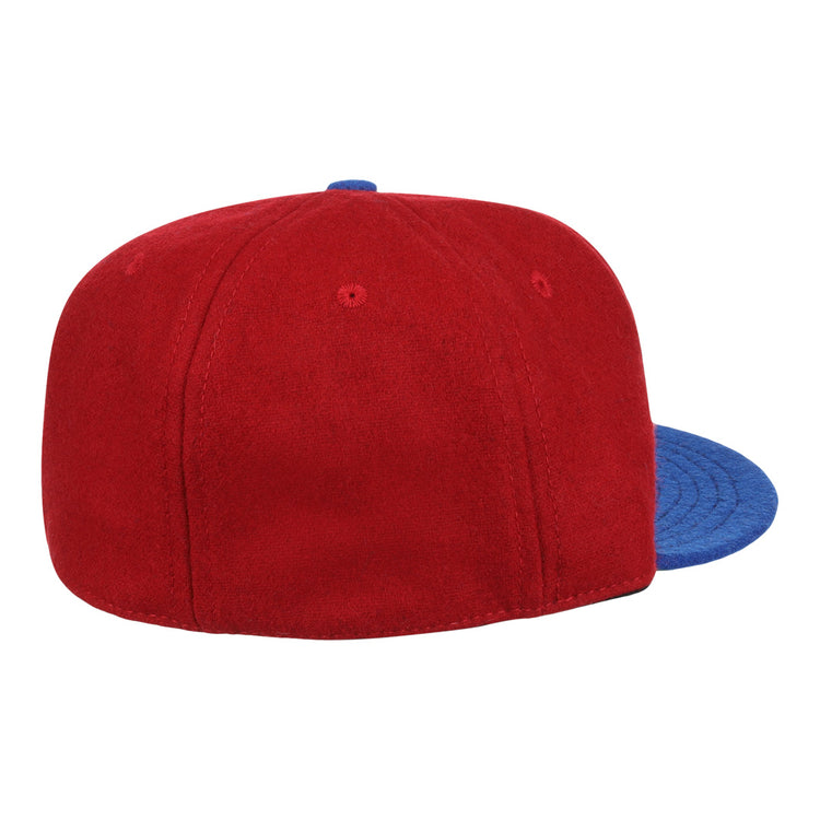 The EFF Memphis Red Sox 1946 Vintage Ballcap, a red wool cap with blue brim, is shown from back and side on a white background, echoing the classic style of the Negro American League team.