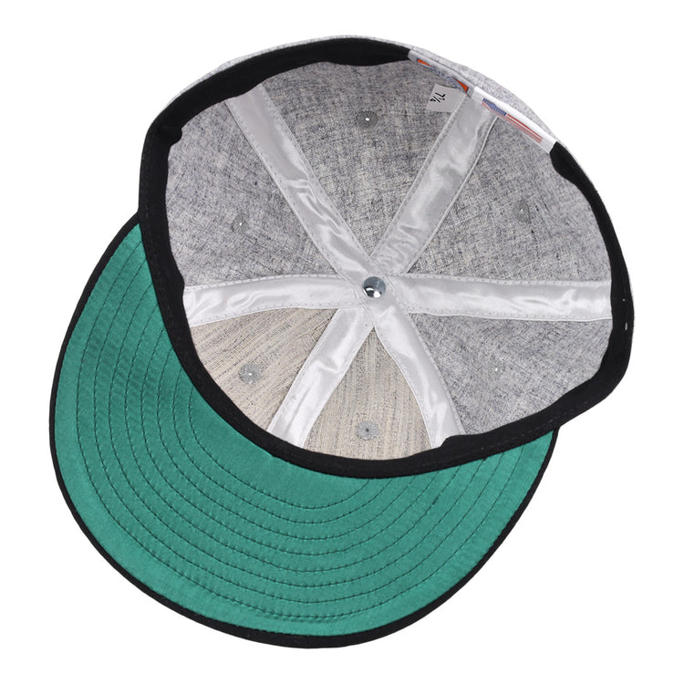 The image displays the inside of the EFF Chicago Union Giants 1902 Vintage Ballcap, with a gray crown, green brim, black trim, and white inner seams radiating from the center top button.