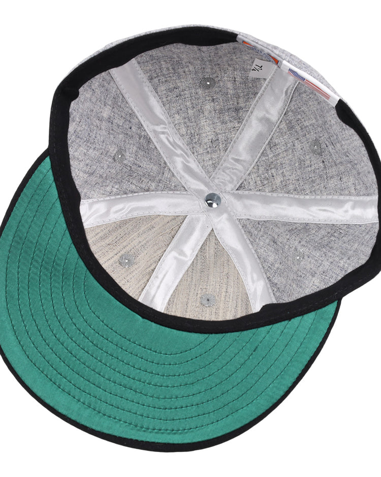 The image displays the inside of the EFF Chicago Union Giants 1902 Vintage Ballcap, with a gray crown, green brim, black trim, and white inner seams radiating from the center top button.
