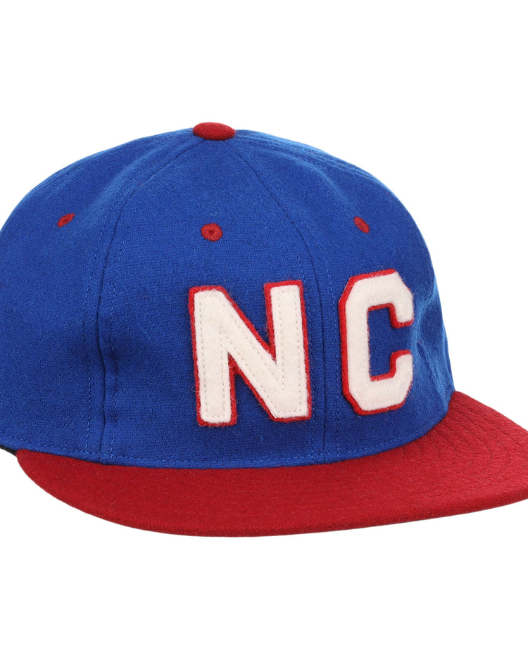 The EFF Nashville Cubs 1946 Vintage Ballcap is a blue wool cap with a red brim and button, showcasing large white NC letters outlined in red on the front—a tribute to Negro Southern League history.