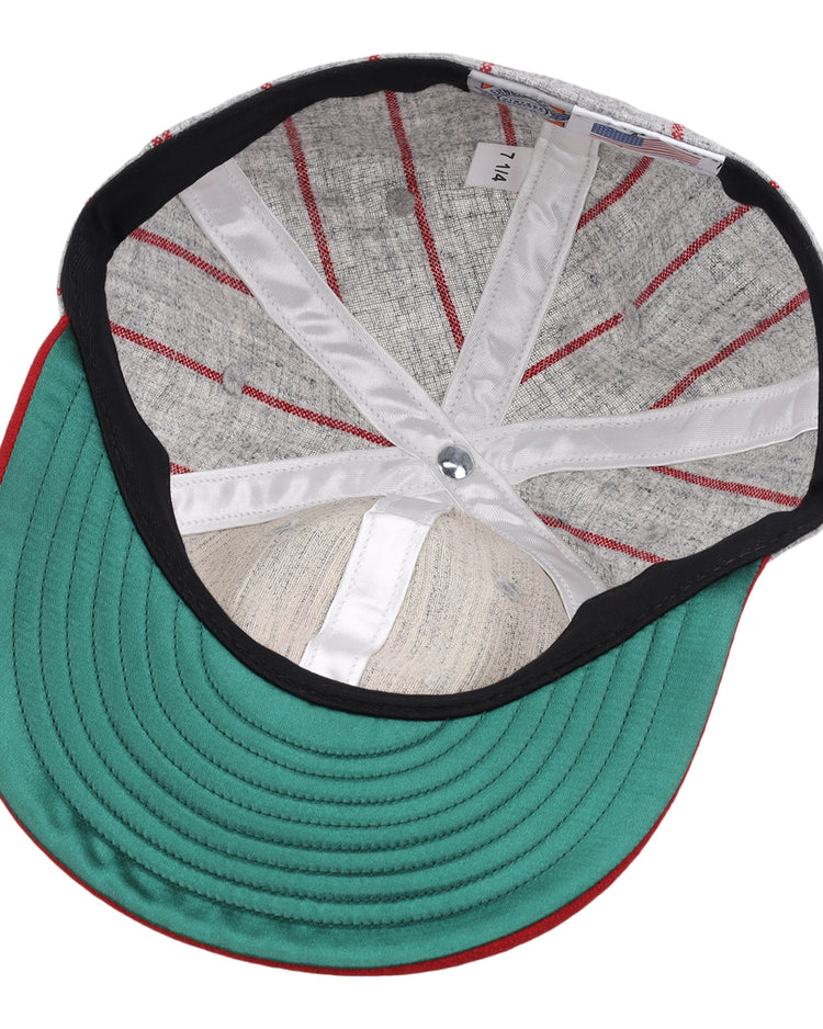 The image displays the inside of an EFF Indianapolis ABCs 1916 Vintage Ballcap, featuring a green brim, red stitching, fabric liner, silver top button, and a white 7 1/4 size tag reminiscent of classic Negro Leagues style.