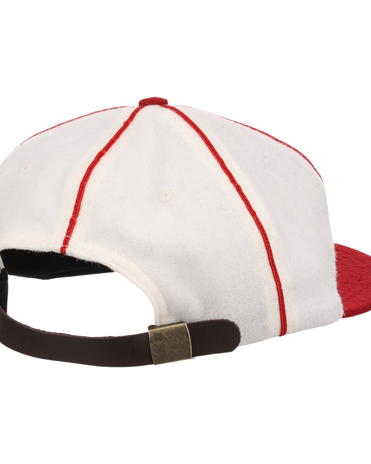 The EFF Washington Elite Giants 1936 Vintage Ballcap is shown from the back with white fabric, red seams, a red brim, and an adjustable brown strap with a brass-colored buckle.
