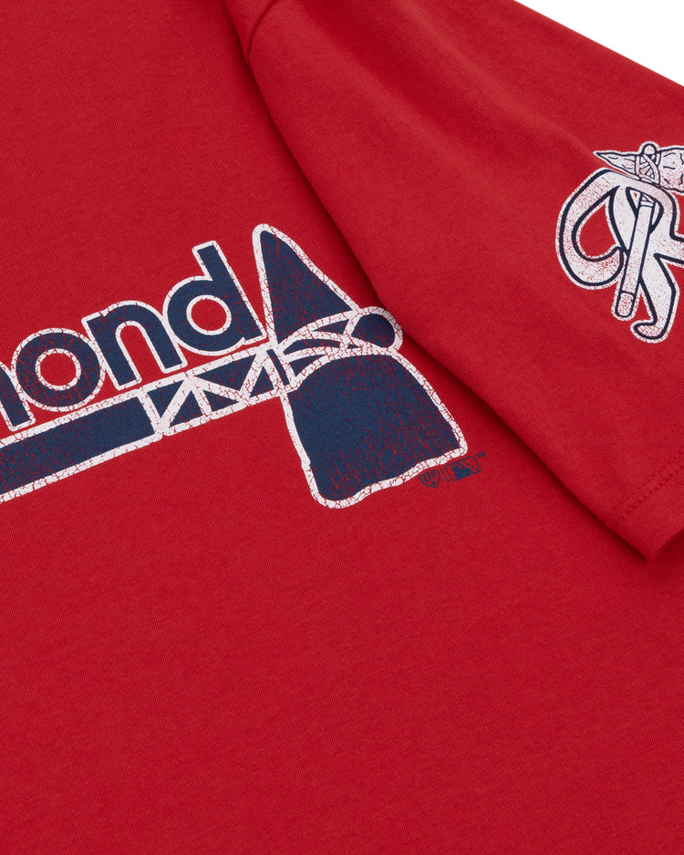 Close-up of a red Richmond Braves EFF MiLB Vintage T-Shirt by Ebbets Field Flannels, featuring Diamond in blue and white on the chest with a stylized bat, plus an embroidered International League logo with bat and glove on the sleeve.