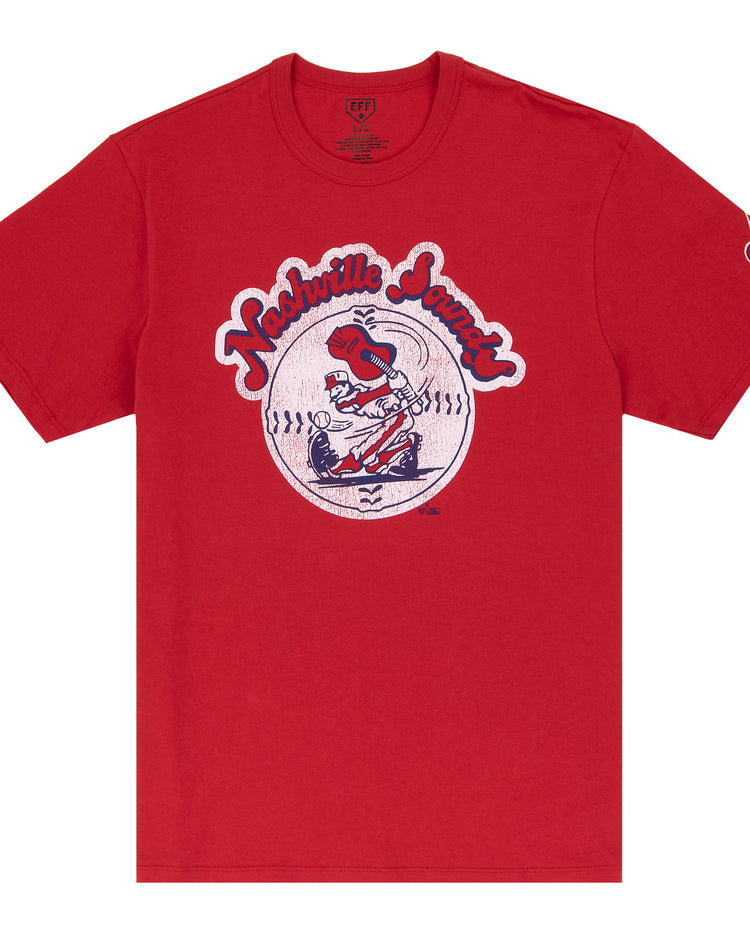 Show your support for the Nashville Sounds with this Ebbets Field Flannels EFF MiLB Vintage T-Shirt, featuring a retro cartoon baseball player swinging a bat in front of a record—ideal for vintage Minor League fans.