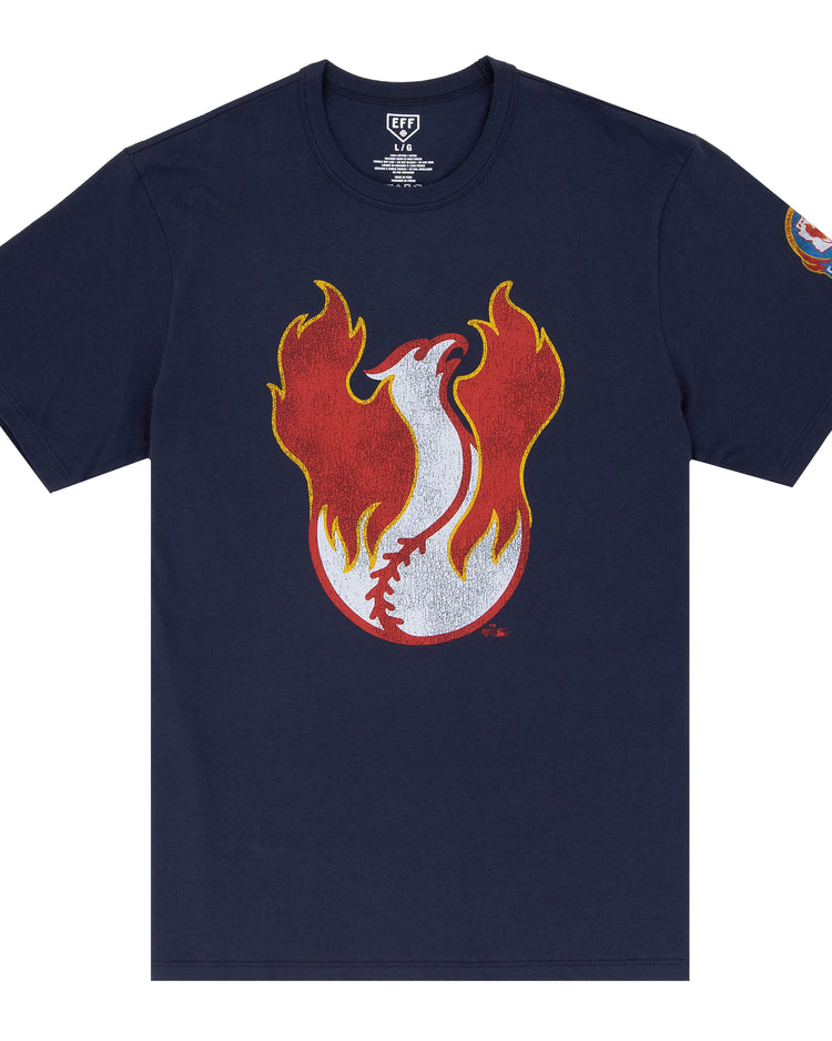 The Phoenix Firebirds EFF MiLB Vintage T-Shirt by Ebbets Field Flannels features a flaming baseball graphic on navy blue, a colorful left sleeve patch, and is inspired by vintage Pacific Coast League designs.