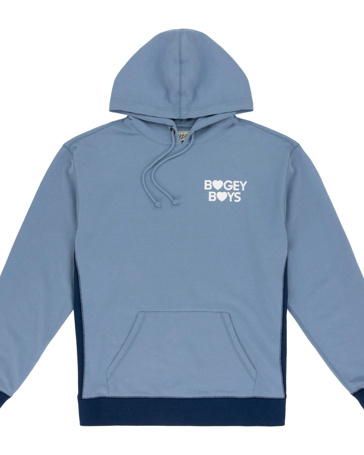 The EFF Bogey Boys x EFF French Terry Hoodie is a light blue fleece hoodie with a front pocket, navy trim, and “BOGEY BOYS” (heart instead of “O”) in white on the chest, blending comfort with golf-inspired style.