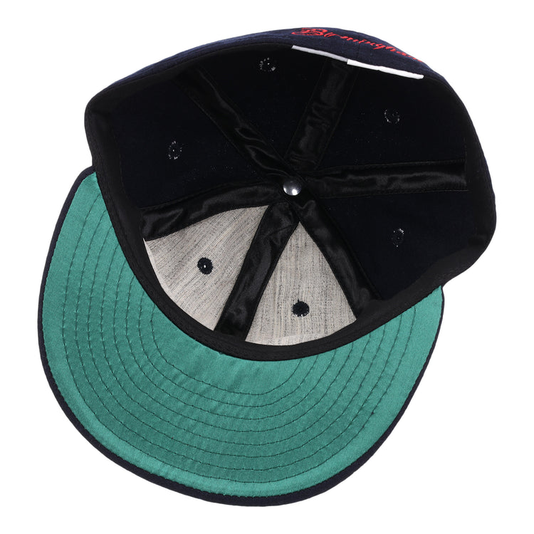 An overhead view of the EFF Birmingham Barons Letterhead Wool Vintage Ballcap shows its green underbrim, grey crown lining, black inner seams, and classic metal rivet—hallmarks of an authentic wool ballcap.