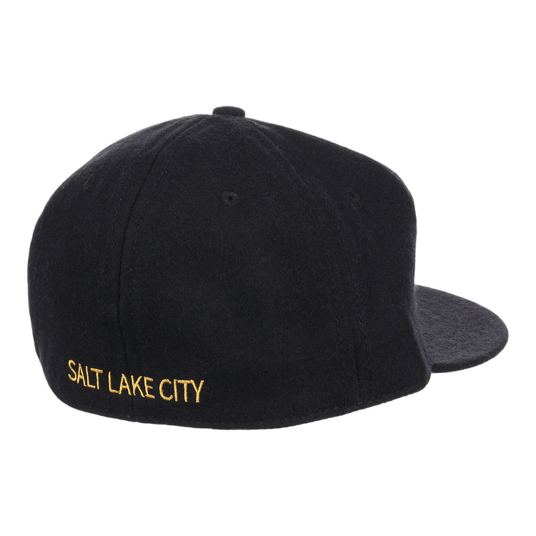The Salt Lake City Bees Letterhead Wool Vintage Ballcap by EFF is a black wool cap with SALT LAKE CITY embroidered in yellow on the back left, shown from a rear side angle against a white background and styled like a classic Minor League cap.