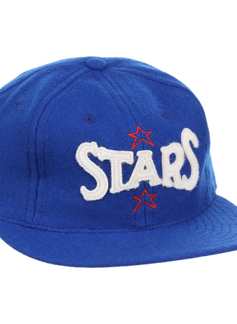 The EFF Hollywood Stars Letterhead Wool Vintage Ballcap is a blue wool hat featuring STARS in large white letters and two red stars, inspired by the classic Pacific Coast League Hollywood Stars cap.