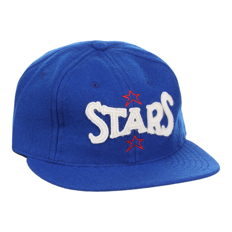 The EFF Hollywood Stars Letterhead Wool Vintage Ballcap is a blue wool hat featuring STARS in large white letters and two red stars, inspired by the classic Pacific Coast League Hollywood Stars cap.