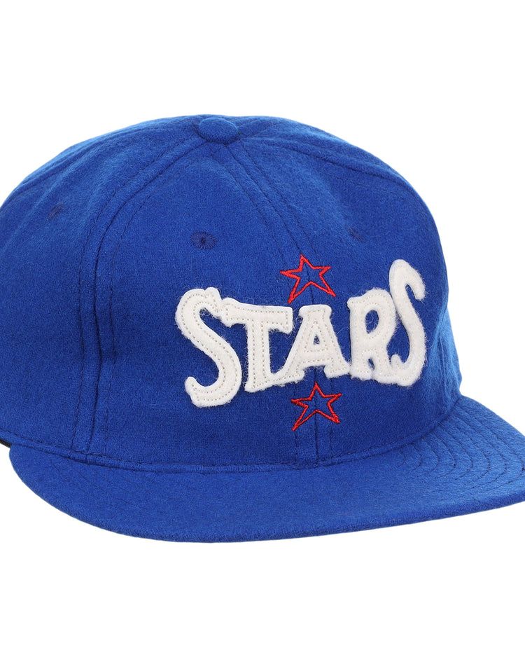 The EFF Hollywood Stars Letterhead Wool Vintage Ballcap is a blue wool hat featuring STARS in large white letters and two red stars, inspired by the classic Pacific Coast League Hollywood Stars cap.