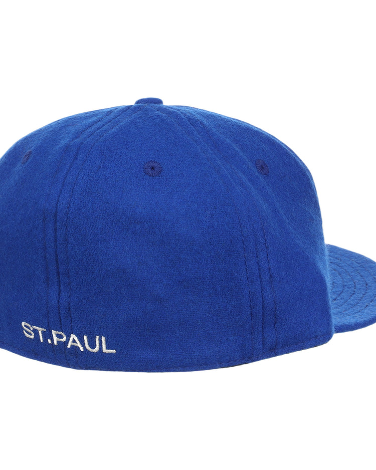 The EFF St. Paul Saints Letterhead Wool Vintage Ballcap is royal blue wool with a flat brim, visible stitching, and features ST. PAUL embroidered in white on the back left, nodding to vintage Saints Minor League logos.