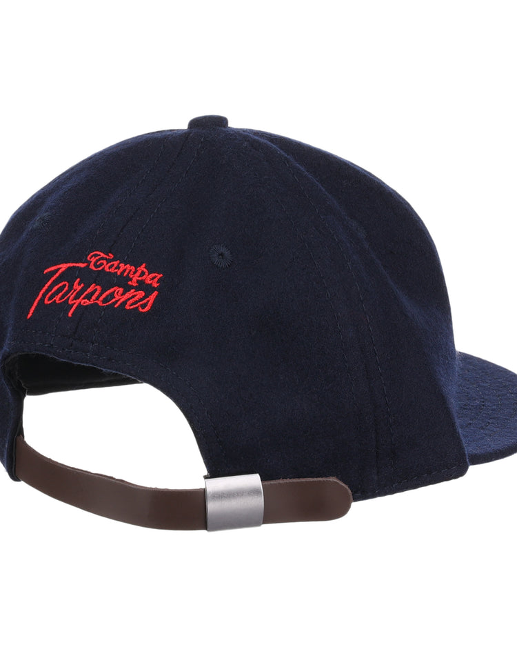 The EFF Tampa Tarpons Letterhead Wool Vintage Ballcap is a navy blue cap with red Tampa Tarpons embroidery on the back and an adjustable brown leather strap with silver buckle, perfect for Minor League baseball fans.
