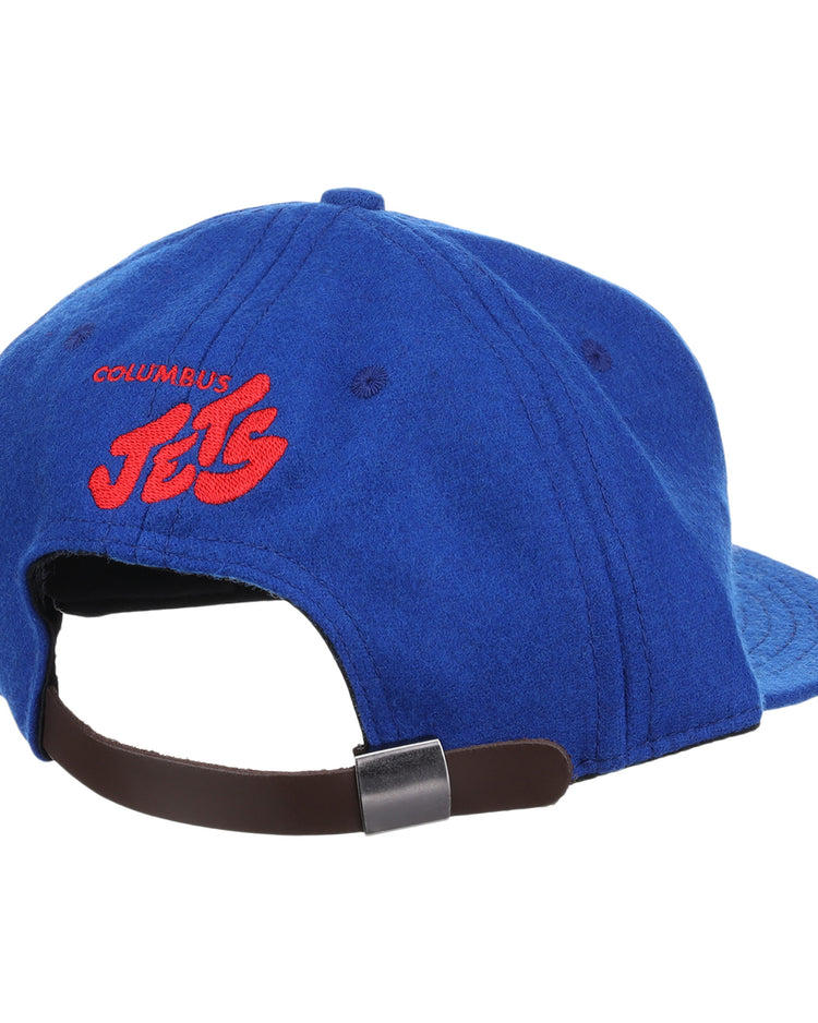 The EFF Columbus Jets Letterhead Wool Vintage Ballcap is a blue Minor League hat viewed from the back, featuring red embroidered COLUMBUS JETS text and a brown adjustable strap with metal clasp.