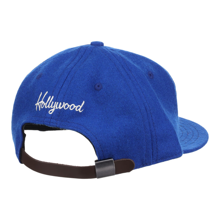 The EFF Hollywood Stars Letterhead Wool Vintage Ballcap features Hollywood embroidered in white on the back, an adjustable brown strap with metal buckle, and classic Pacific Coast League-inspired style.