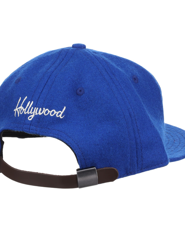 The EFF Hollywood Stars Letterhead Wool Vintage Ballcap features Hollywood embroidered in white on the back, an adjustable brown strap with metal buckle, and classic Pacific Coast League-inspired style.