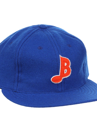 The EFF Memphis Blues Letterhead Wool Vintage Ballcap is a royal blue cap with a flat brim, featuring a red and white stylized B on the front—a classic tribute to Texas League Minor League baseball style.