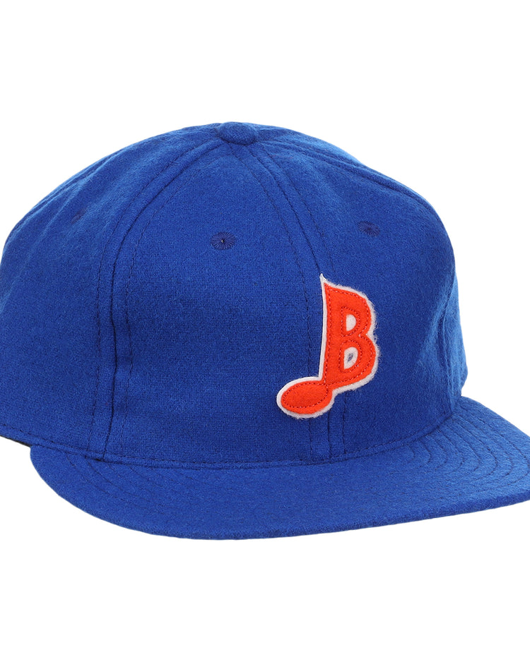 The EFF Memphis Blues Letterhead Wool Vintage Ballcap is a royal blue cap with a flat brim, featuring a red and white stylized B on the front—a classic tribute to Texas League Minor League baseball style.
