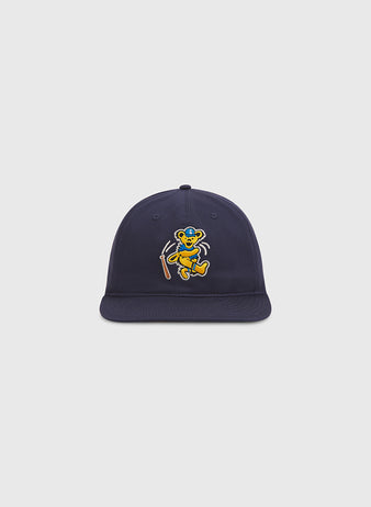 Show your playful spirit with the Grateful Dead Baseball Bear Cotton Twill Ballcap by Ebbets Field—this navy blue hat features an embroidered cartoon bear dancing and holding a walking stick on the front, set against a plain light gray background, making it an ideal choice for fans looking to add a whimsical twist to the classic ballcap.