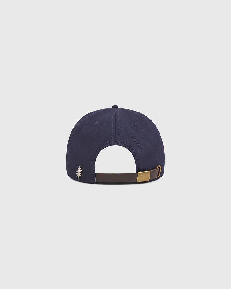 A back view of the Ebbets Field Grateful Dead Baseball Bear Cotton Twill Ballcap in navy blue, featuring a brown adjustable strap with a brass buckle and a small white stitched logo on the left side—ideal for fans looking for a classic Grateful Dead ballcap.