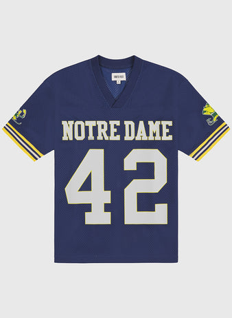 Show your team spirit with the Ebbets Field Notre Dame Mesh Football Jersey—featuring blue mesh fabric, yellow and white sleeve stripes, the number 42 on the front, and a leprechaun mascot on the sleeves—perfect for any Fighting Irish football fan.