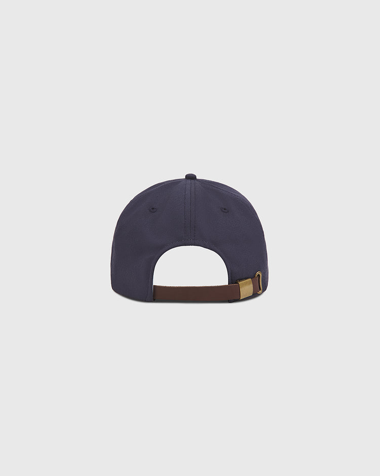 The Ebbets Field Notre Dame Cotton Ballcap is displayed from the back, highlighting its brown adjustable strap with a gold buckle, set against a plain light gray background.
