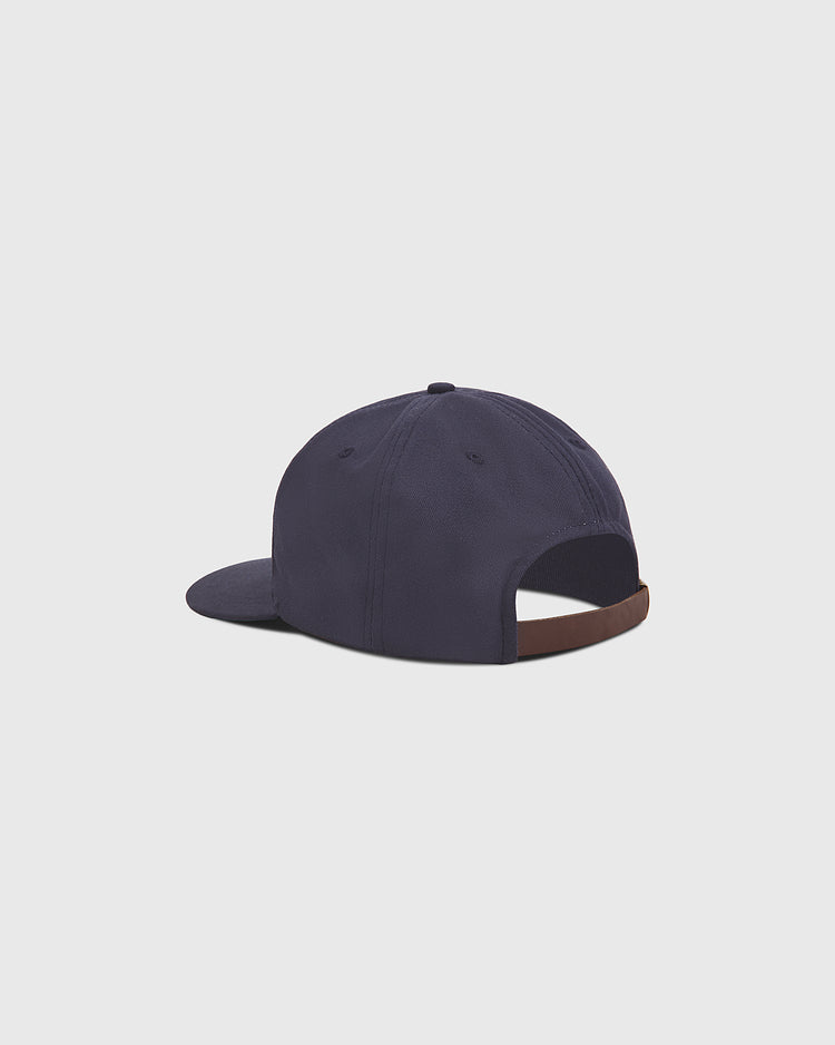 The Ebbets Field Notre Dame Cotton Ballcap is displayed from the back, highlighting its adjustable brown strap and curved brim, set against a plain light gray background.
