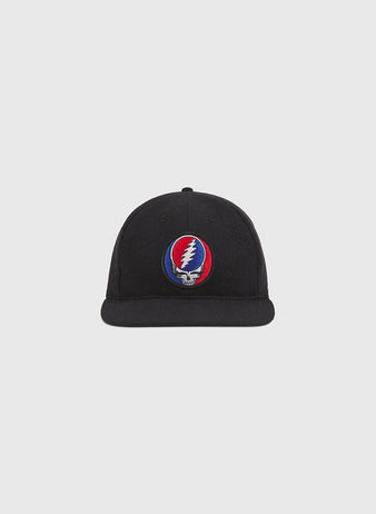 The Ebbets Field Grateful Dead Stealie Wool Ballcap is a black wool hat featuring a vibrant embroidered Stealie logo—a skull adorned with a red and blue lightning bolt—on the front. Shown against a simple light gray background, it’s an ideal accessory for any Grateful Dead fan.
