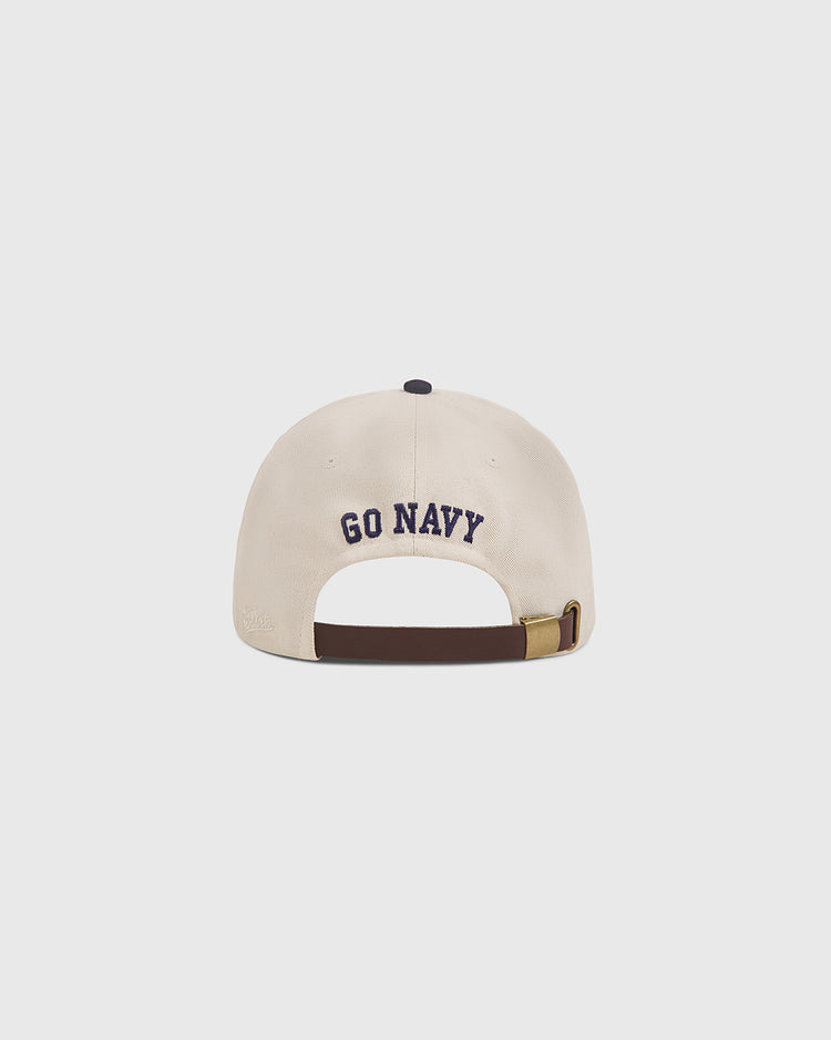 A beige Ebbets Field Navy 1958 Logo Cotton Twill Ballcap viewed from the back, featuring “GO NAVY” embroidered in navy blue above the adjustable brown strap.